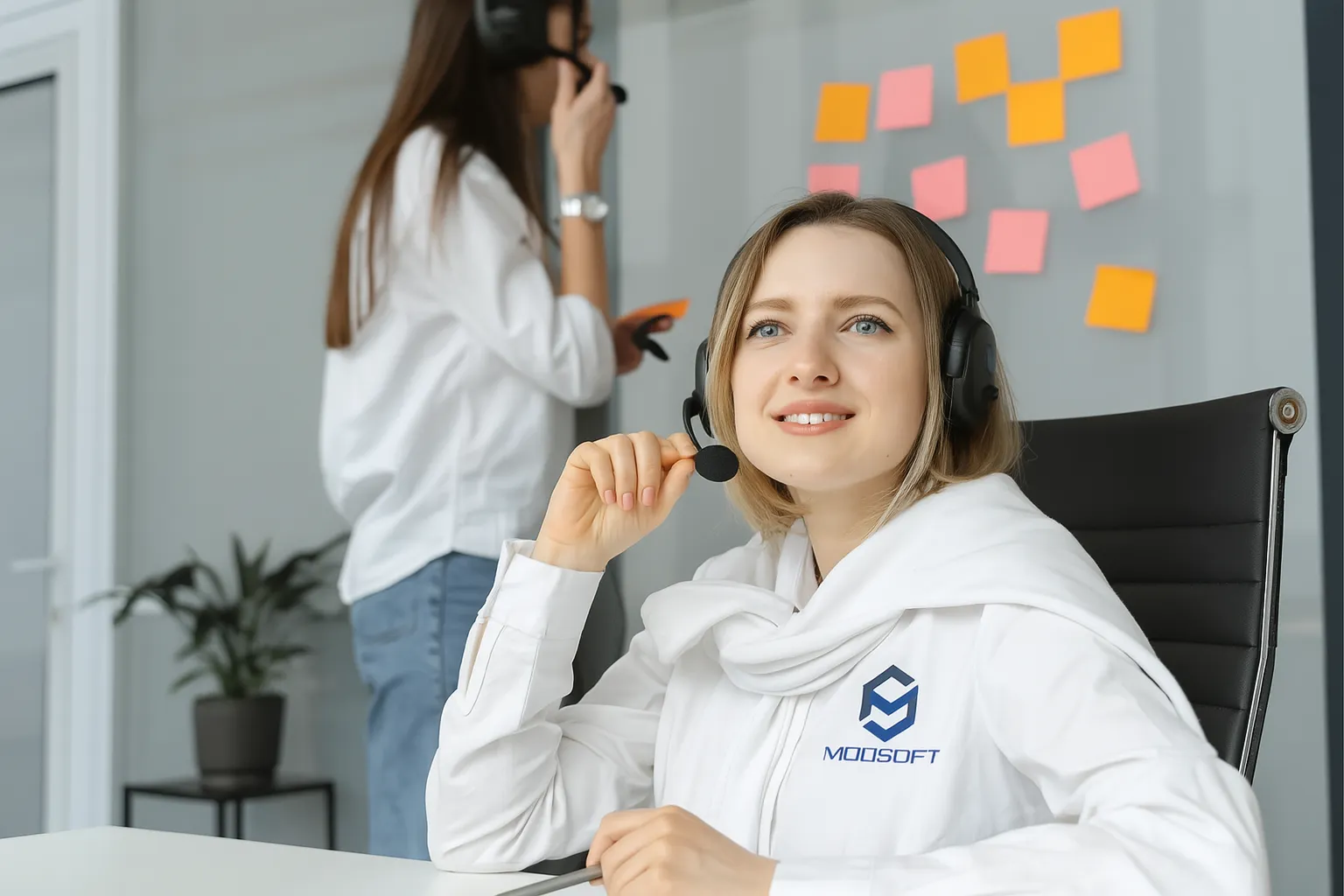 Modsoft AI-powered customer support team collaborating in a modern office with headsets